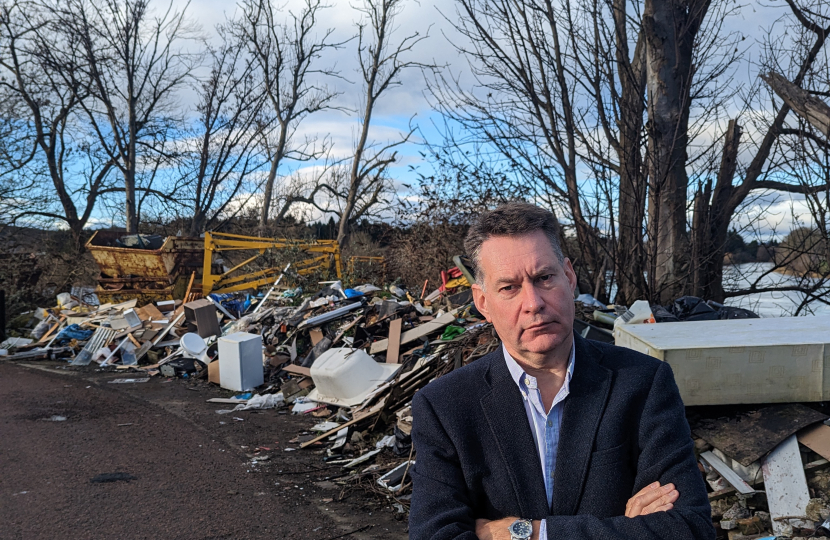 Murdo beside the fly-tipping near the River Tay in Perth